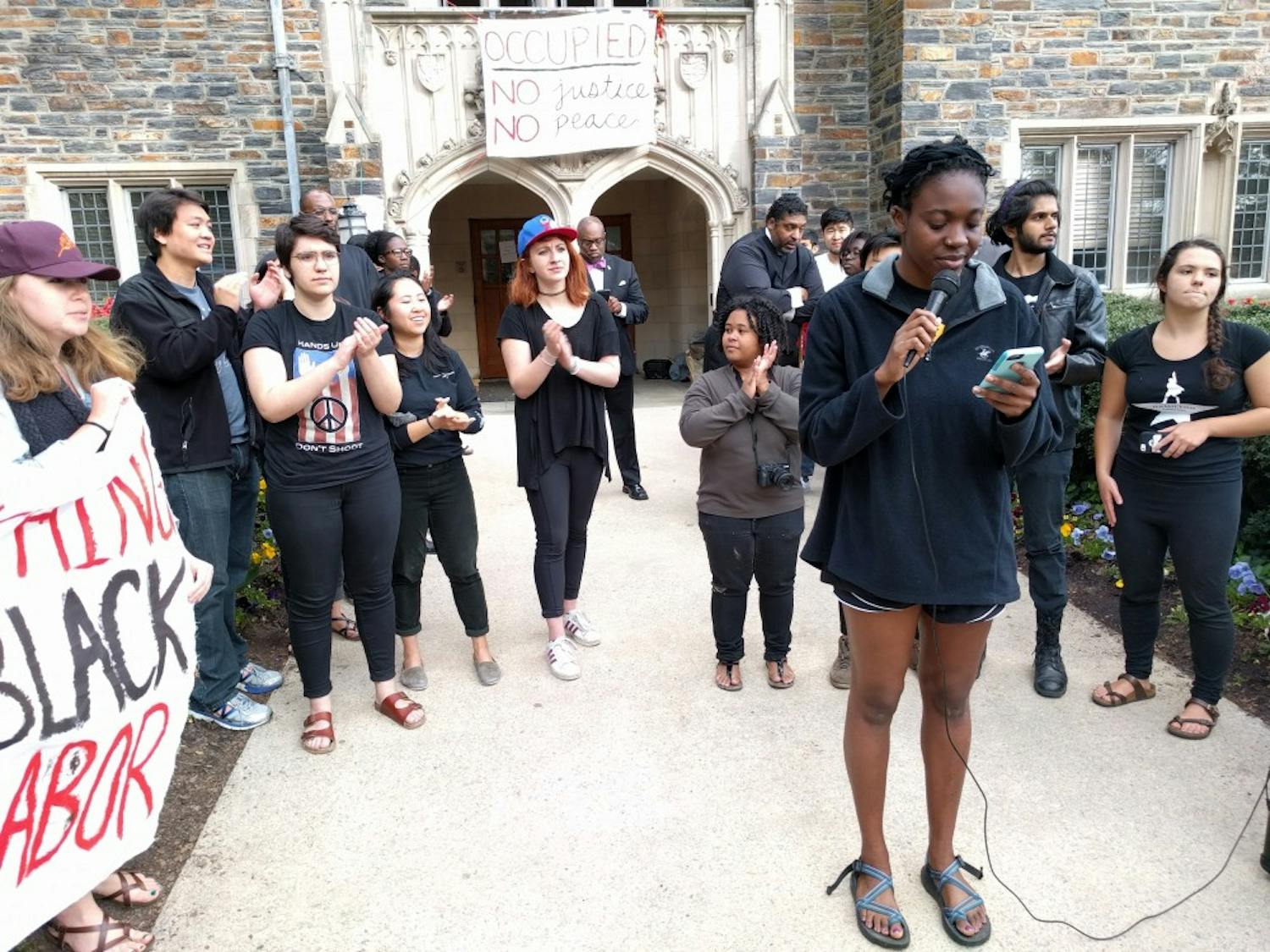 The eight students read statements after exiting the Allen Building.
