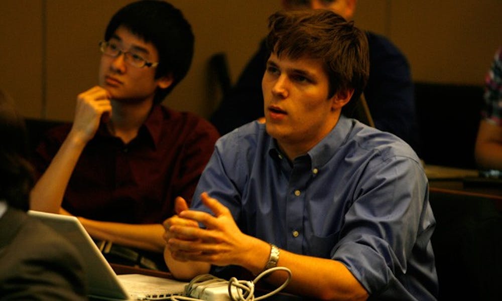 SOFC committee member Herng Lee (left) and Pete Schork, vice president for athletics and campus services, debate whether DSG should revoke the Duke College Republicans’ charter.