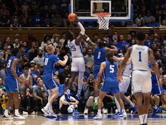Mark Mitchell puts the ball away over a Hofstra defender during Duke's Dec. 12 victory.