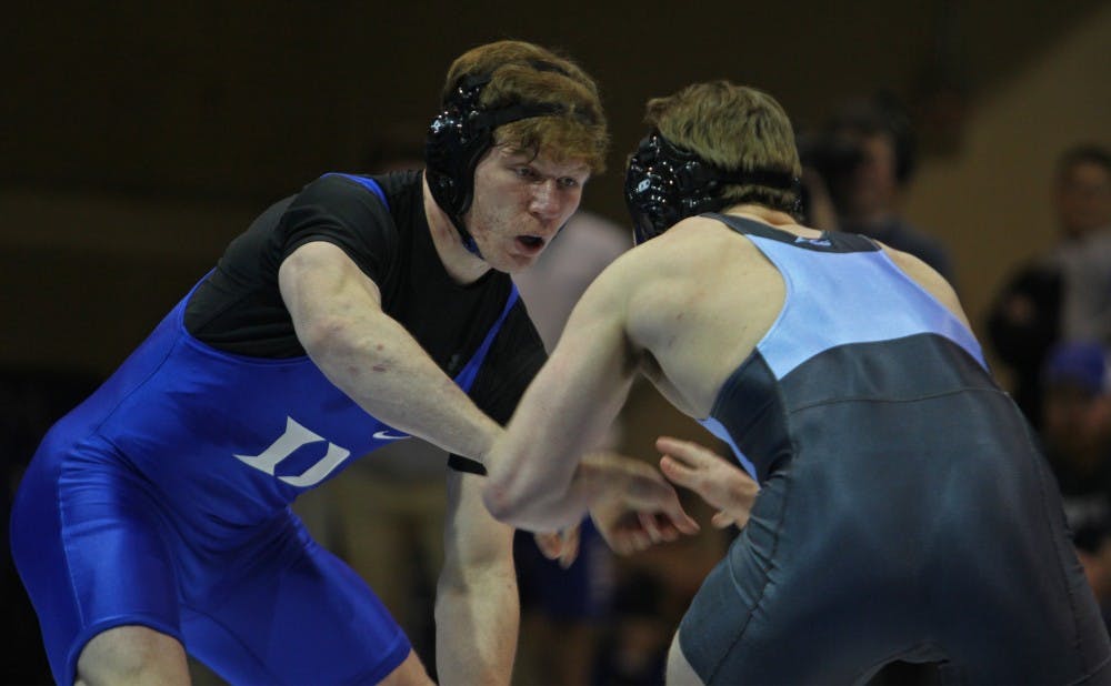 No. 7 Conner Hartmann took down North Carolina's Chip Ness 6-0 in Wednesday's 16-15 loss.