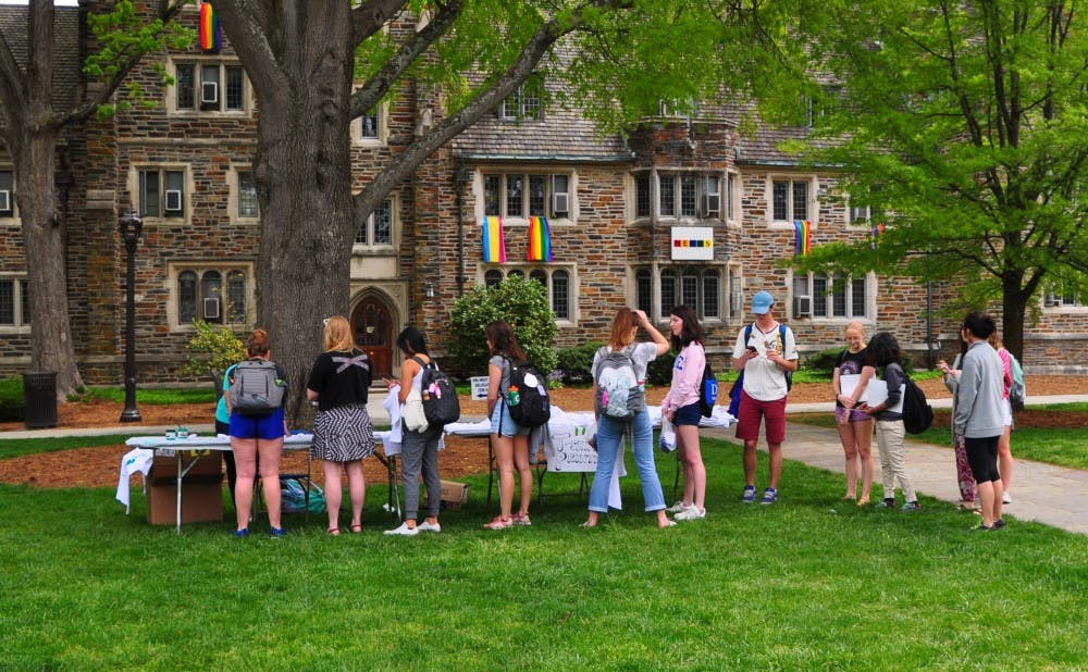 A line of students gathers for t-shirt printing.