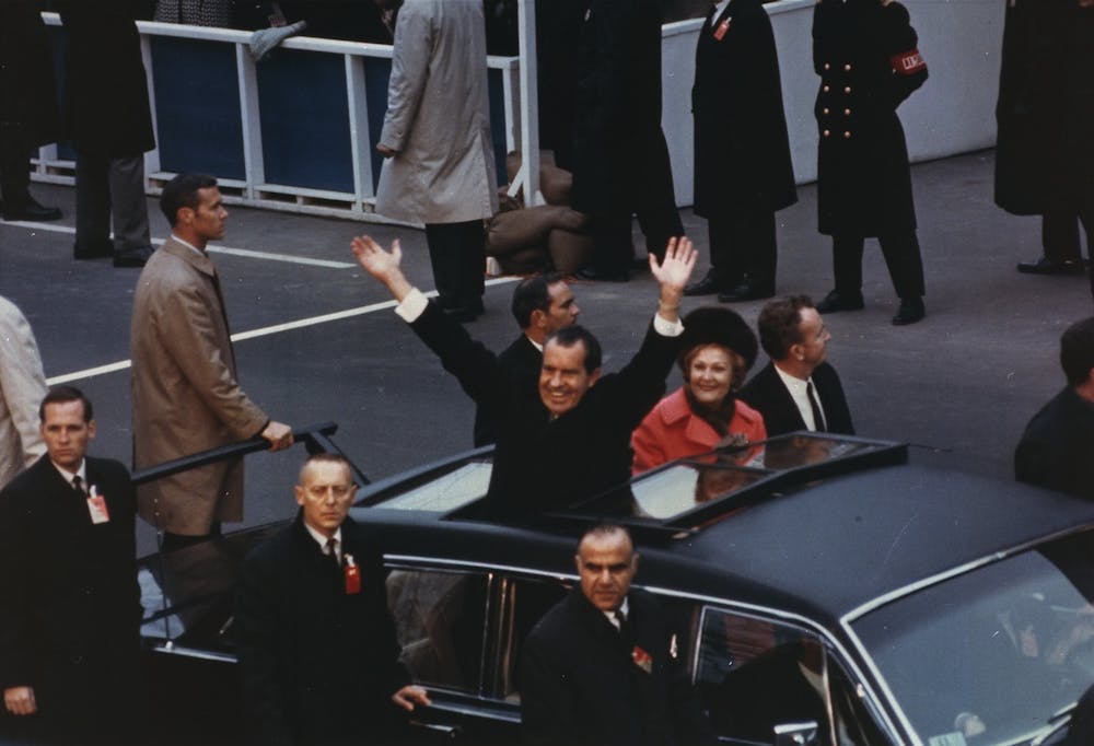 President Richard Nixon waving to the crowd from the presidential limousine in the inaugural motorcade on Jan. 20, 1969.