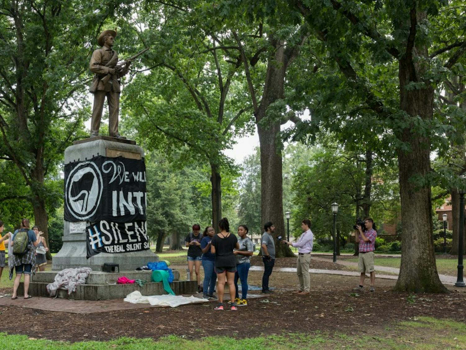 Photo from a protest at the statue before it was pulled down by protesters