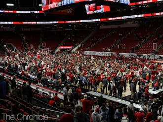 Wolfpack fans stormed the court after the N.C. State win.&nbsp;