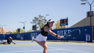 Freshman Shavit Kimchi lunges for the ball during Duke's match with Virginia.