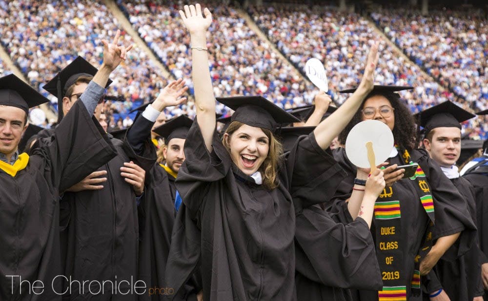 <p>Students celebrate at Duke's commencement ceremony in 2019.</p>