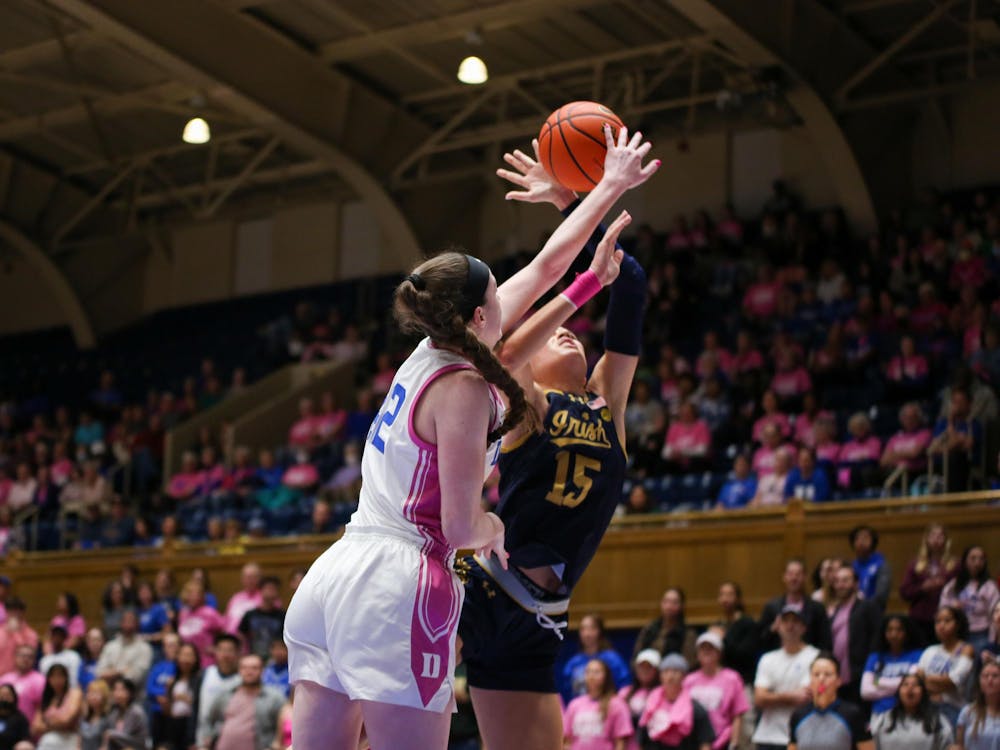 Kennedy Brown blocks Notre Dame's Natalija Marshall en route to a five-block game. 