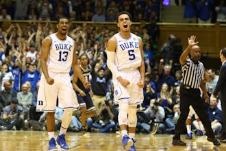 Tyus Jones and Matt Jones react during the Blue Devils' 43-7 run that blew the game open in the first half.