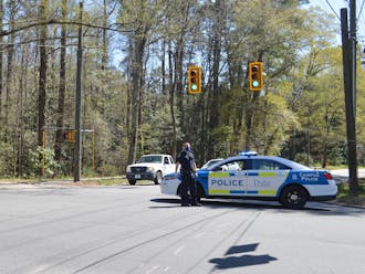 DUPD officers were stationed along Duke University Road Tuesday afternoon during the search for a suspect.&nbsp;
