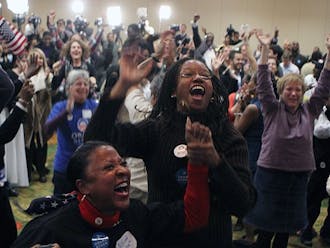 Local Democrats cheers as results roll in, showing a victory for President Barack Obama.