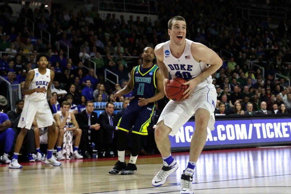 <p>Graduate student Marshall Plumlee slammed home eight dunks on his way to a career-high 23 points Thursday against UNC-Wilmington.</p>