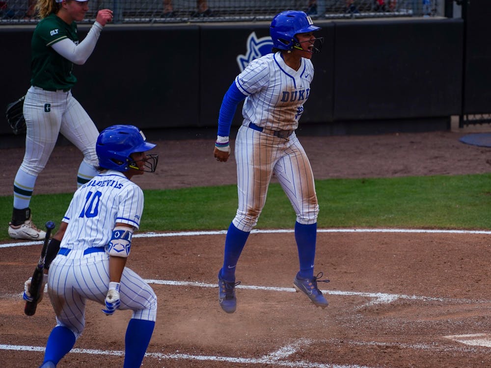 D'Auna Jennings (left) and Jada Baker (right) celebrate after Duke beat Charlotte to advance to the Super Regional.