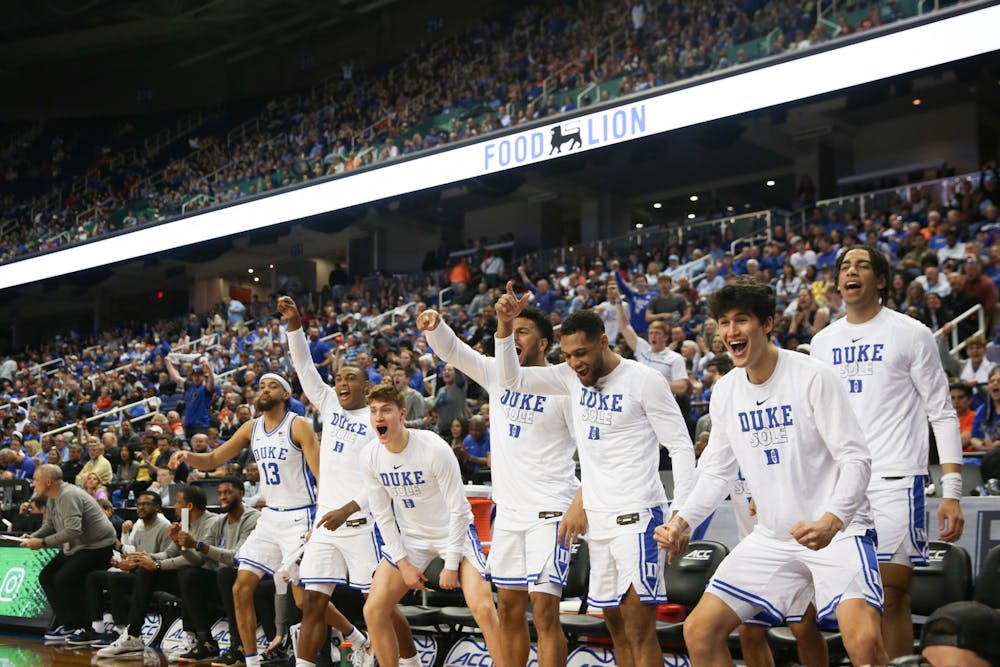 The bench celebrates after a Dereck Lively II three during Duke's blowout win Thursday against Pittsburgh.