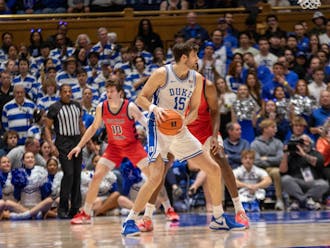 Ryan Young scans the floor during Duke's win against Southern Indiana.