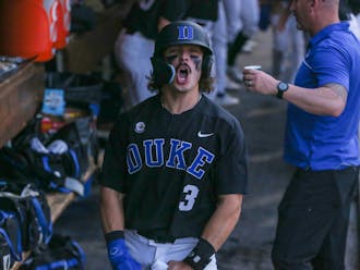 Duke freshman Andrew Fischer celebrates in the dugout during the Blue Devils' blowout win against Campbell on April 4. The Manasquan, N.J., native set the school's freshman home run record with two against Boston College this weekend.