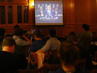 Students watch from the Old Trinity Room as President Barack Obama delivers his State of the Union address, which focused on innovation and the importance of American economic advancement.