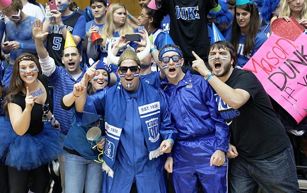 Sam Tasher, center in the Viking helmet, is in his eighth and final  year attending Duke. A win against Virginia Tech Tuesday would give Tasher 100 wins at Cameron Indoor Stadium.