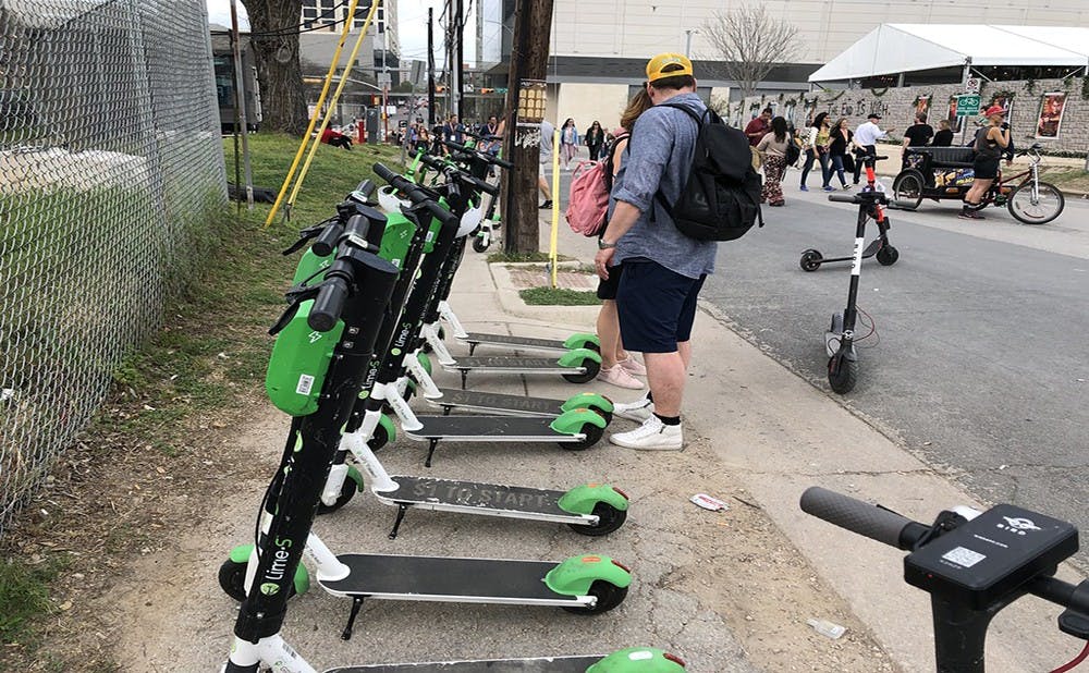 Lime scooters lined up, just as they will be in spots around Durham. Courtesy of Flickr.