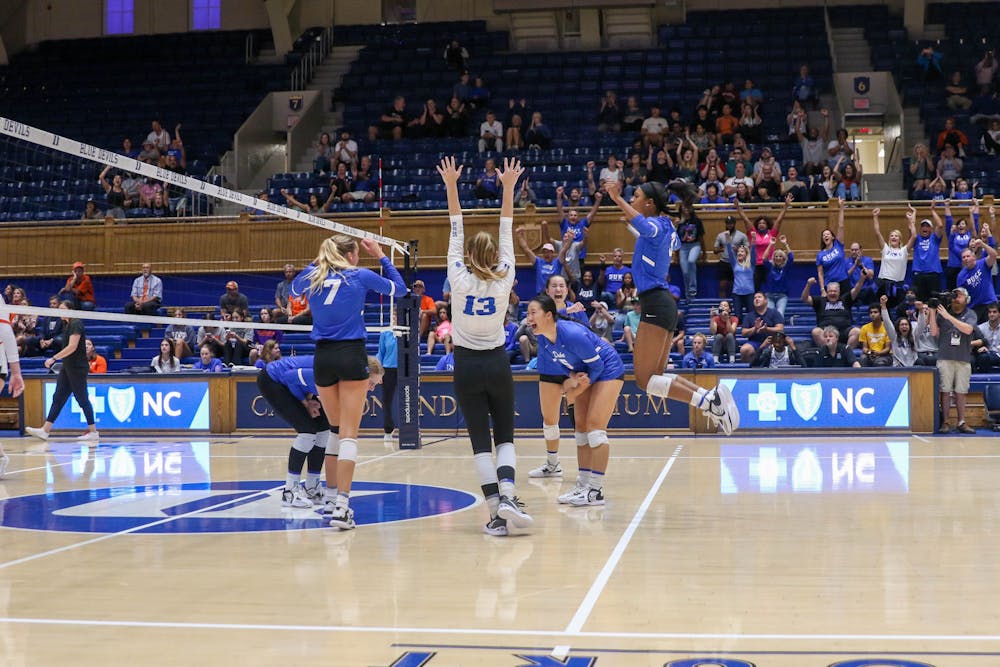 <p>The Blue Devils celebrate after winning a point in their Sunday victory against Clemson.</p>