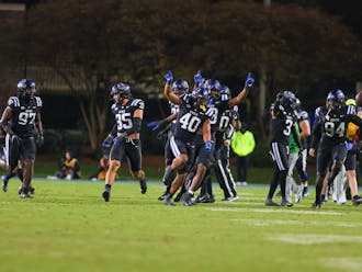 Duke football players celebrate Todd Pelino's last-second field goal to seal the win against Wake Forest.