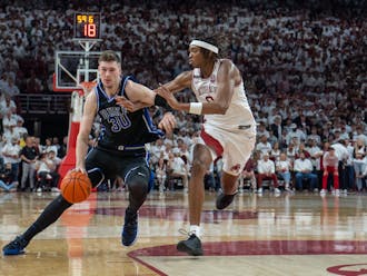 Kyle Filipowski holds off an Arkansas defender as he drives to the rim during Duke's Wednesday defeat.