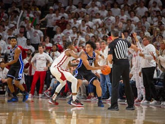 Jared McCain scans the floor for an out-route under pressure during Duke's Wednesday defeat at Arkansas.
