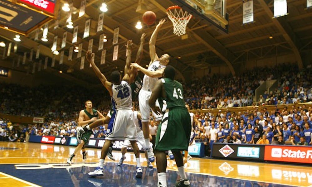 Lance Thomas (left), Miles Plumlee and the rest of the Duke defense held Charlotte to under 34 percent shooting in Tuesday’s easy win.