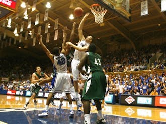 Lance Thomas (left), Miles Plumlee and the rest of the Duke defense held Charlotte to under 34 percent shooting in Tuesday’s easy win.