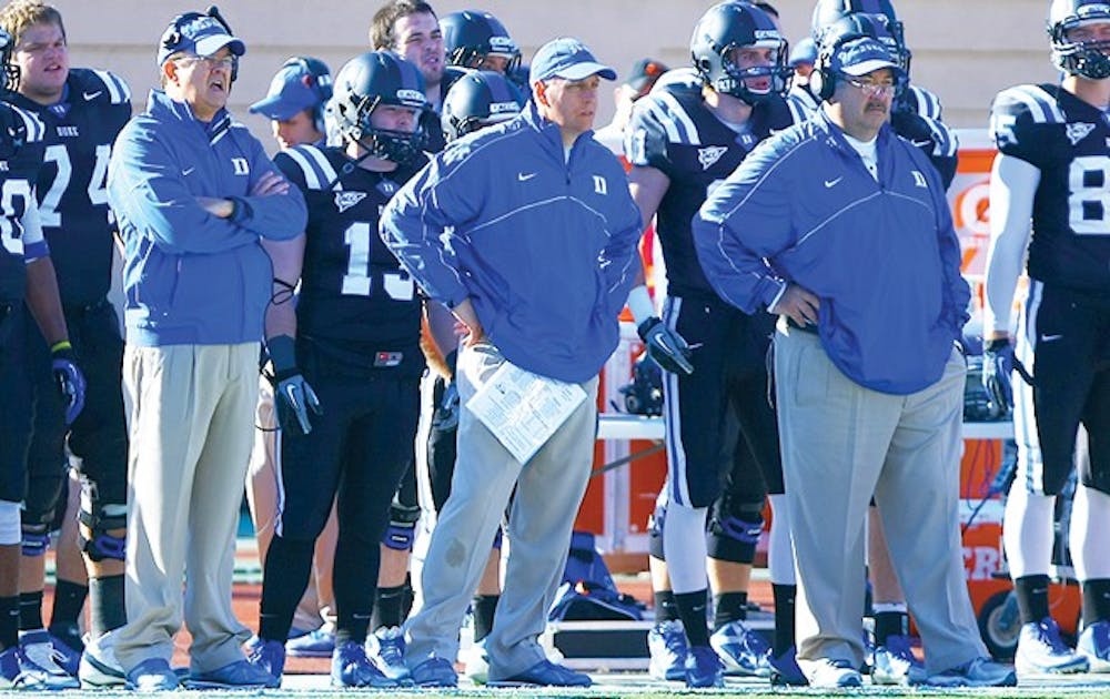 Kurt Roper has coached with David Cutcliffe (left) since they were together at Tennessee in 1998.