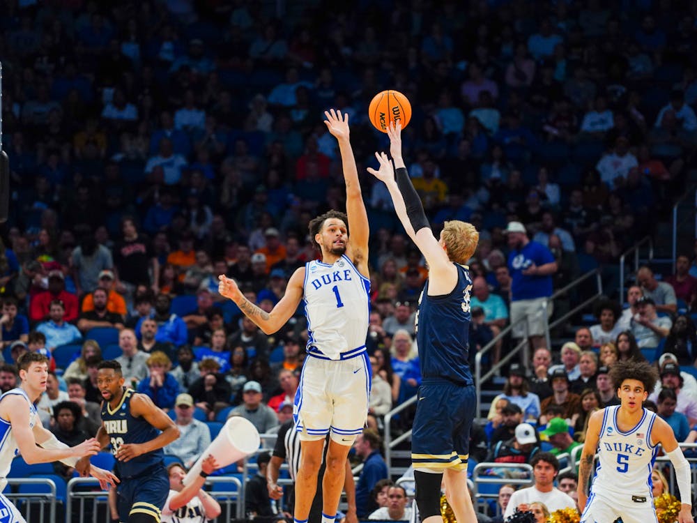 Dereck Lively II reaches up to block a shot in Duke's win against Oral Roberts.