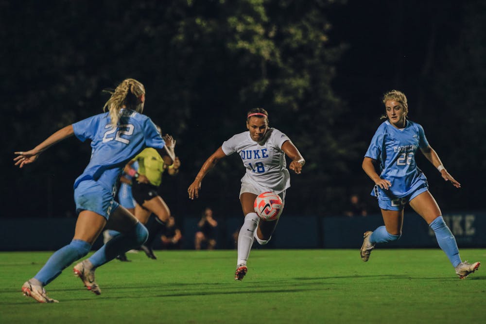 Michelle Cooper goes after a bouncing ball in Duke women's soccer's September 2022 game against North Carolina.