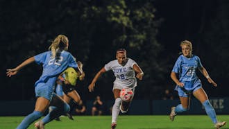 Michelle Cooper goes after a bouncing ball in Duke women's soccer's September 2022 game against North Carolina.