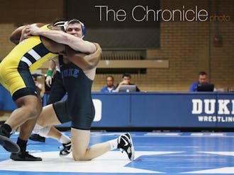 The Blue Devils won two major decisions Sunday but could not overcome lopsided defeats in several weight classes.