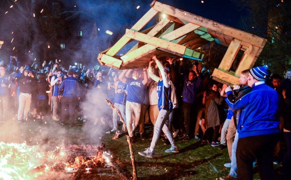 Students carried several benches into a bonfire on the quad after Thursday's win.