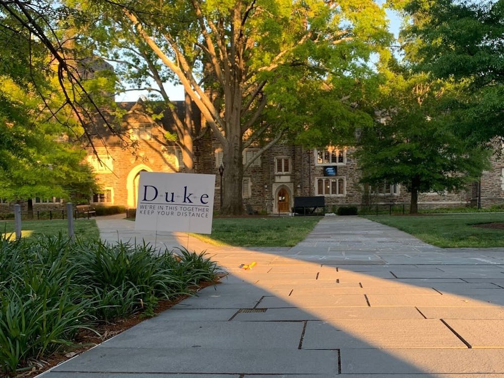 <p>On a usual LDOC, students would gather on Abele Quad for a concert and other festivities. In 2020, a sign reminded the reader to stay distanced from others.</p>