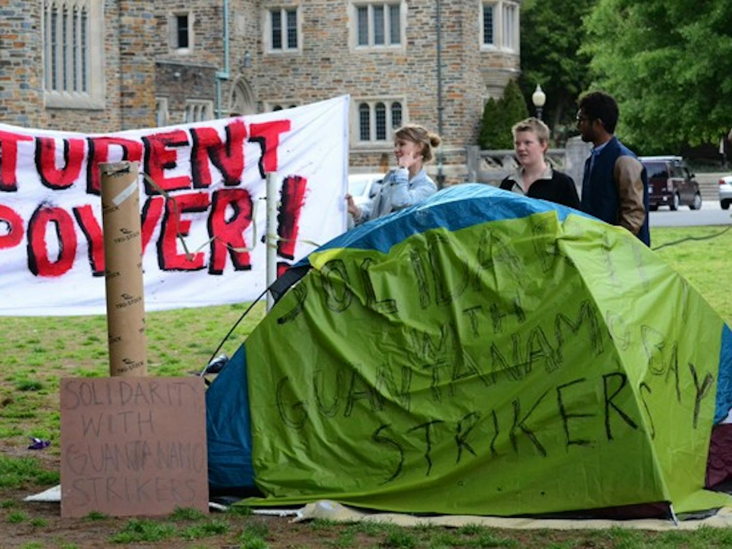 Students from Duke and UNC show support for a hunger strike among Guantanamo Bay prisoners on the Chapel Quad Monday. The protesters plan to occupy the quad indefinitely.