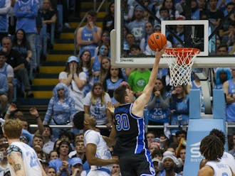 Kyle Filipowski lays one in during the first half of Duke's Saturday win at North Carolina.
