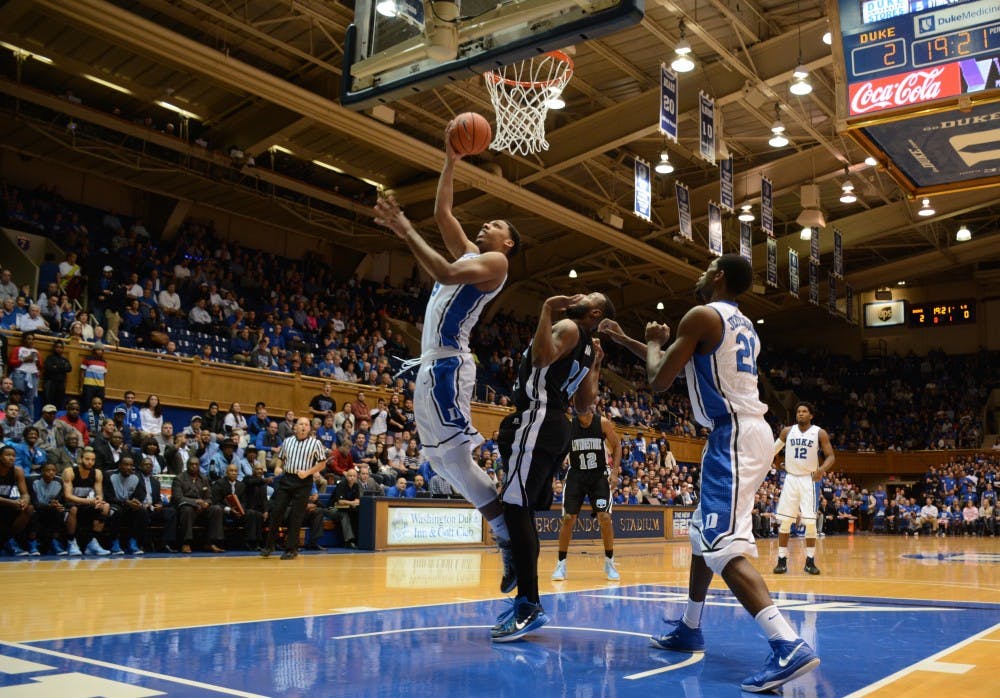 Freshman Jahlil Okafor had 15 points and five rebounds as the Blue Devils steamrolled Livingstone in their first exhibition contest Tuesday night.