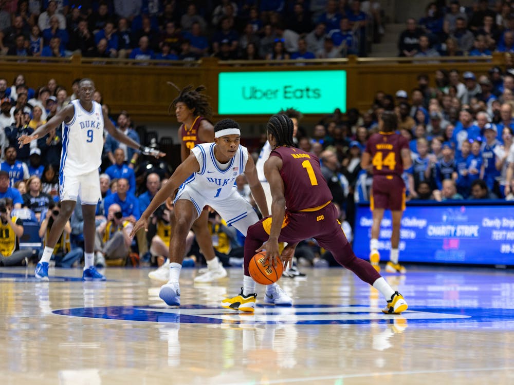 <p>Caleb Foster defends Alston Mason in Duke's exhibition against Arizona State.&nbsp;</p>