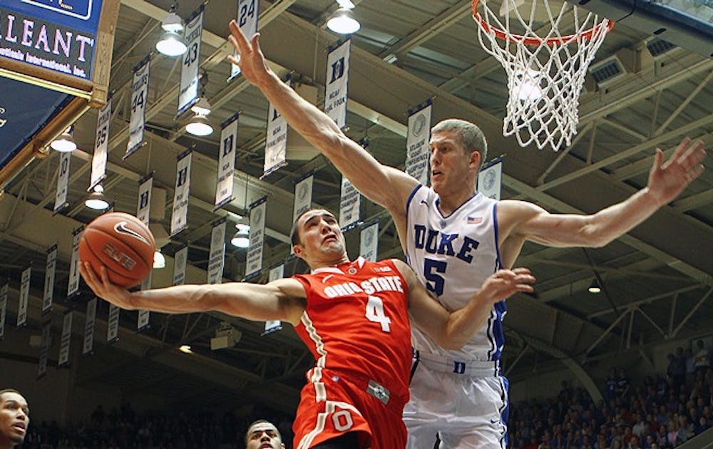 Senior forward Mason Plumlee leads No. 2 Duke with 21 points and career-high-tying 17 rebounds in their 73-68 comeback win over No. 4 Ohio State Wednesday.