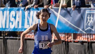 Amina Maatoug sprints for her ninth-place finish at the 2023 NCAA Cross Country Championships.