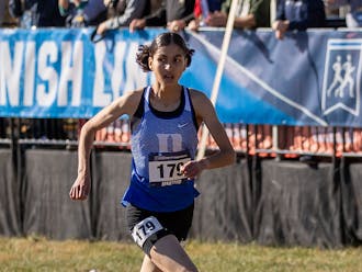 Amina Maatoug sprints for her ninth-place finish at the 2023 NCAA Cross Country Championships.