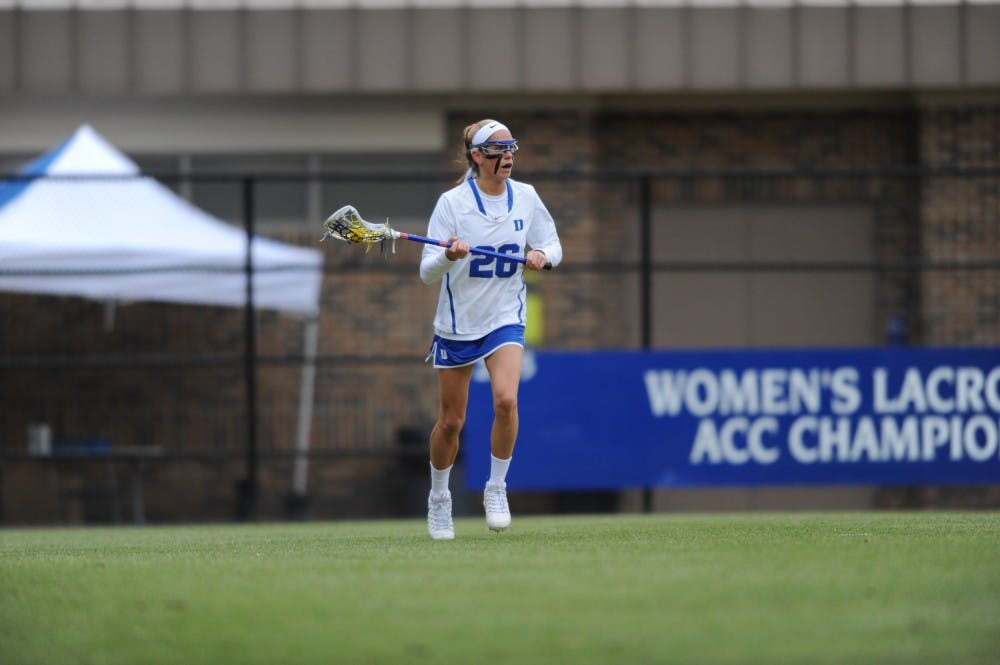 <p>Senior Kelci Smesko scored a career-high six goals Friday as the Blue Devils doubled up Navy 18-9 on the road.</p>