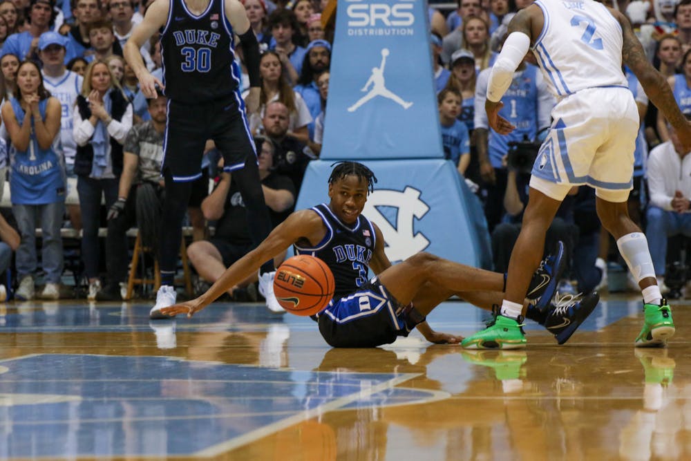 Jeremy Roach hits the floor for a loose ball during Duke's Saturday win at North Carolina.