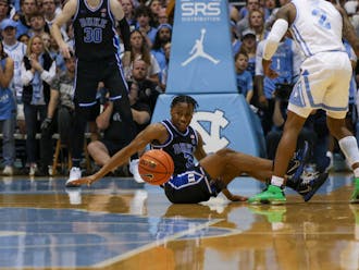 Jeremy Roach hits the floor for a loose ball during Duke's Saturday win at North Carolina.