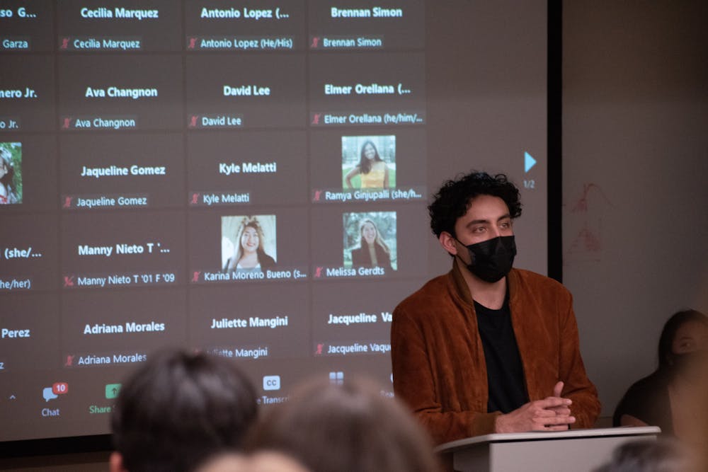 <p>Carlo-Alfonso Garza stands at a podium during the Latinx Student Demands teach-in hosted February 9, 2022.</p>