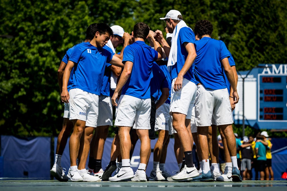 Duke players huddle during their Saturday matchup with UNC Wilmington.