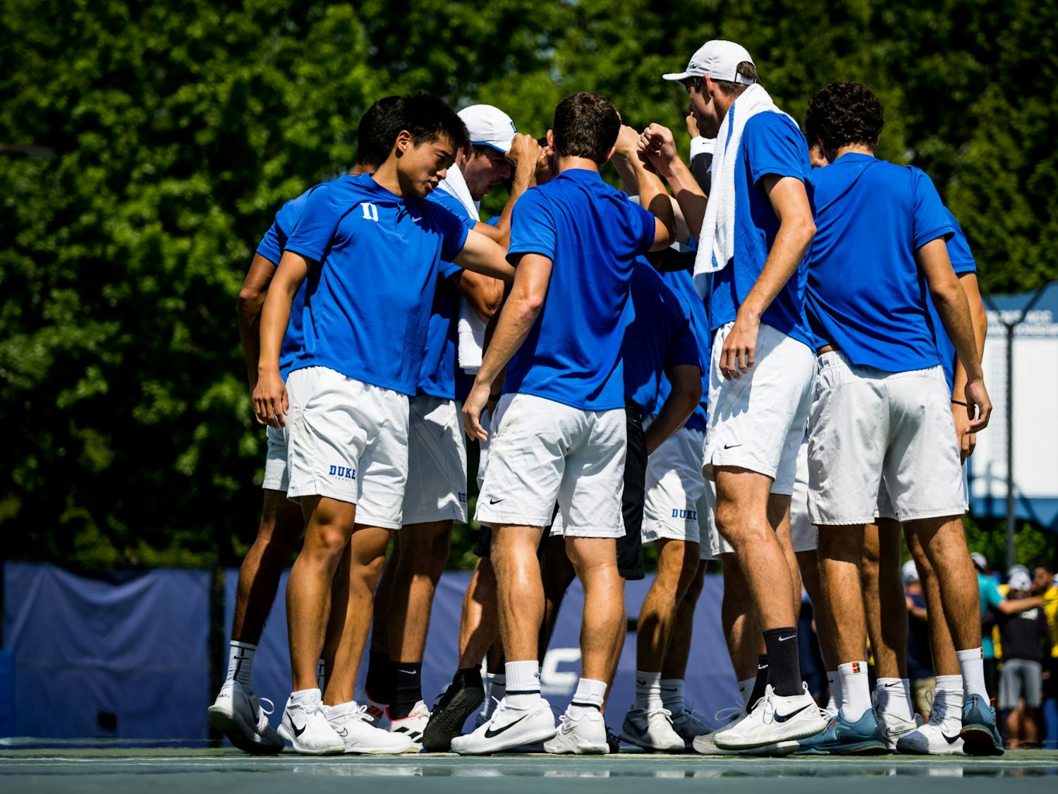 Duke players huddle during their Saturday matchup with UNC Wilmington.