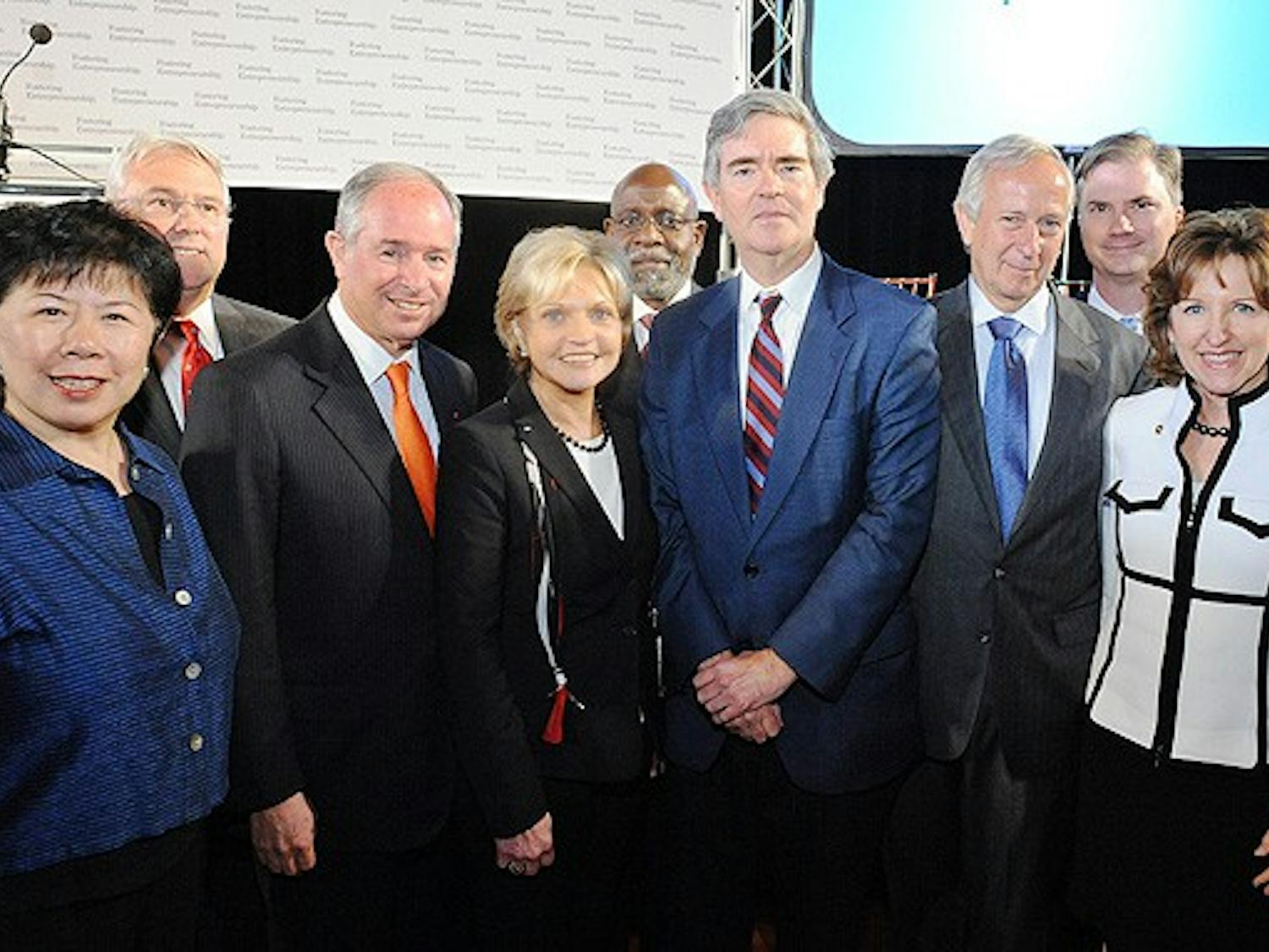National, state and local university leaders pose at the launch of the Blackstone Entrepreneurs Network at the American Tobacco Campus Monday.