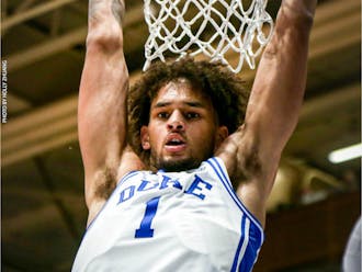 Duke men's basketball's Dereck Lively II hangs from the win during the Blue Devils' Saturday win against Boston College.